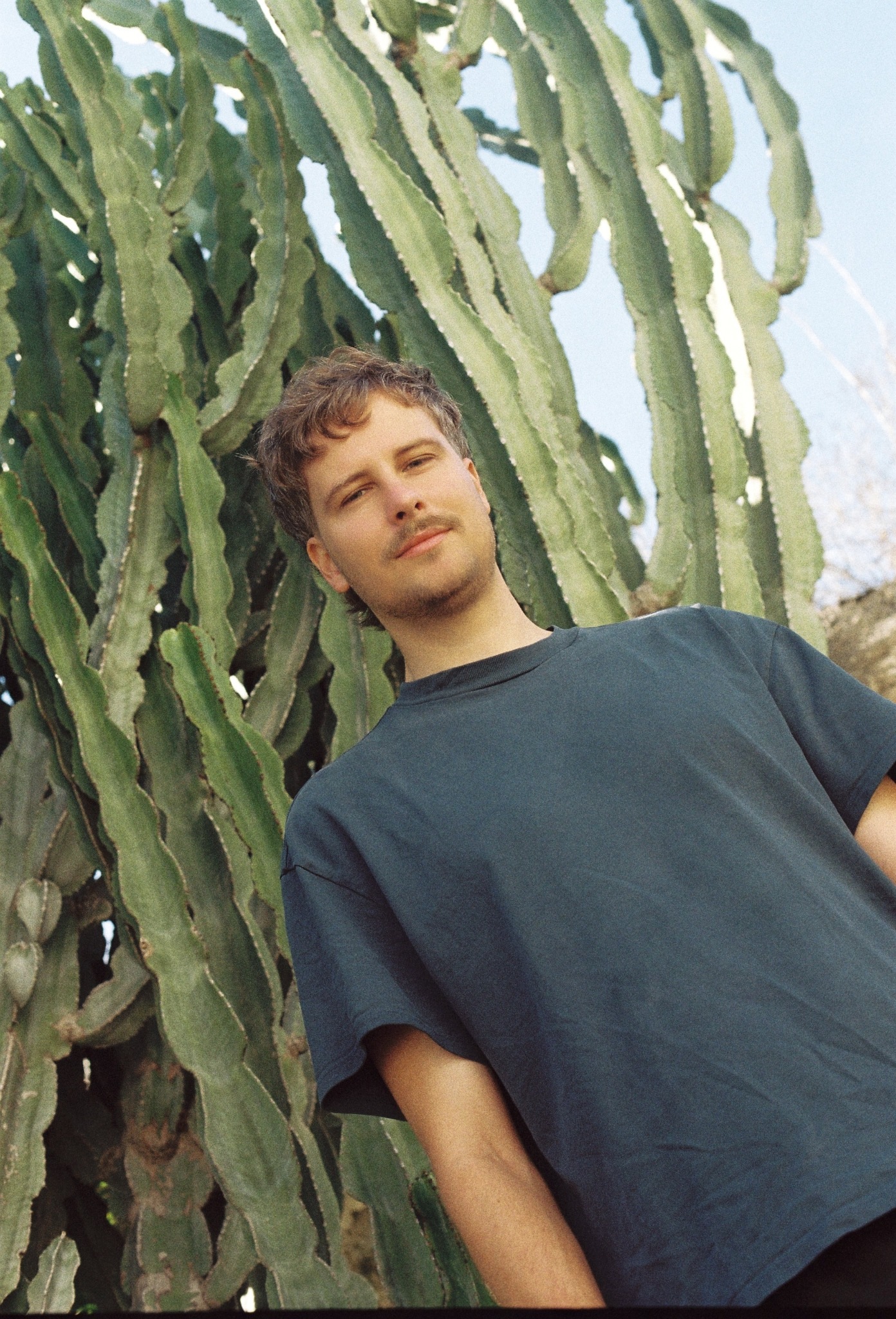 Bondi standing beside a cactus